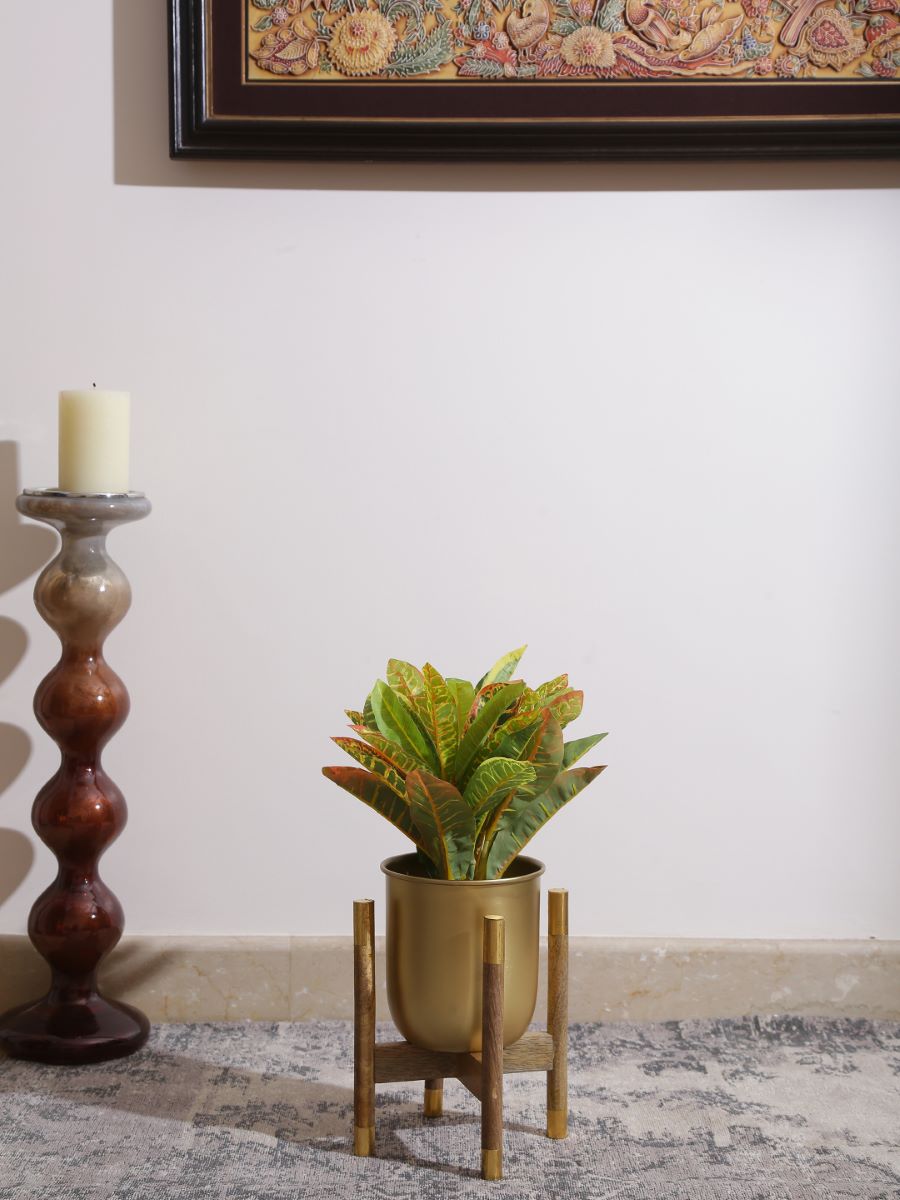 Metal Planter On Wooden Stand In Brass Finish