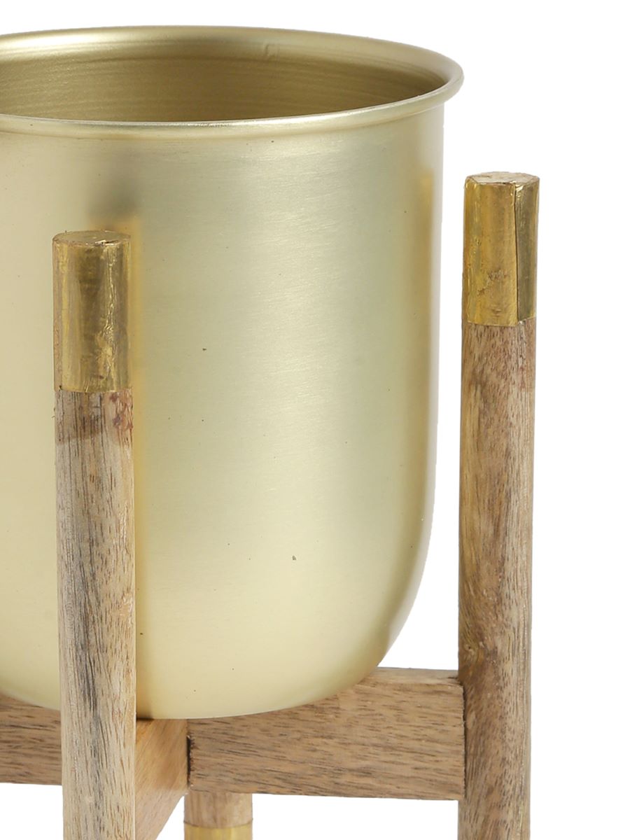 Metal Planter On Wooden Stand In Brass Finish