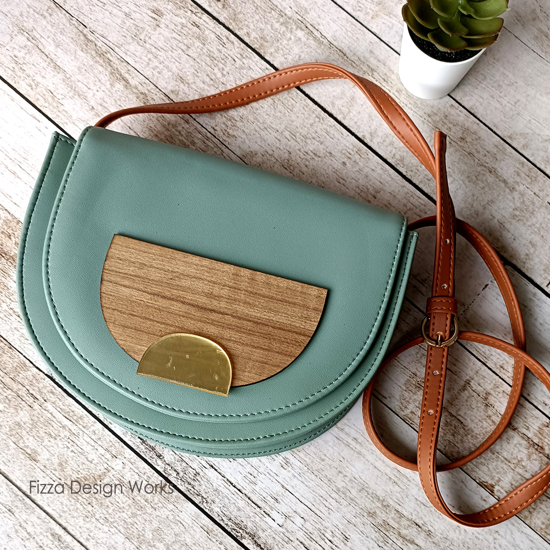Half Circle Sling Bag With Applique Detail